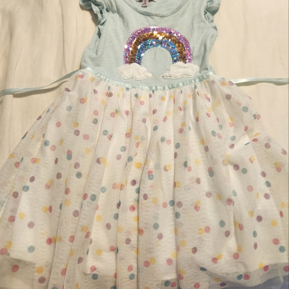 VGC. Featuring a rainbow sequin and darling flutter sleeves